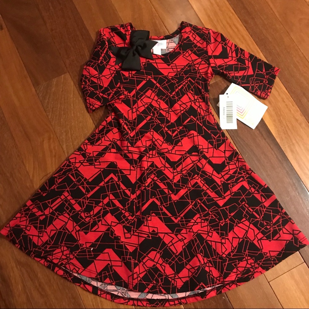 Size 2 LuLaRoe Adeline with matching hair bow